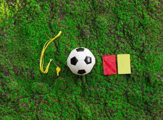 soccer ball, whistle and referee cards