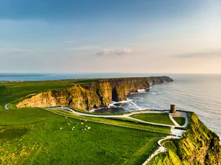 Fotobehang World famous Cliffs of Moher, one of the most popular tourist destinations in Ireland. Aerial view of known tourist attraction on Wild Atlantic Way in County Clare. © MNStudio
