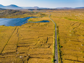 Beautiful sunset view of Connemara region in Ireland. Scenic Irish countryside landscape with magnificent mountains on the horizon, County Galway, Ireland.