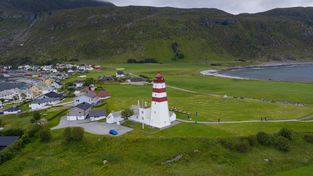 Alnes Lighthouse, old and famous building, established in 1852 to guide fishing boats to the harbor of the fishing community of Alnes, More og Romsdal county, Norway. Aerial(drone) view in jule, 2019