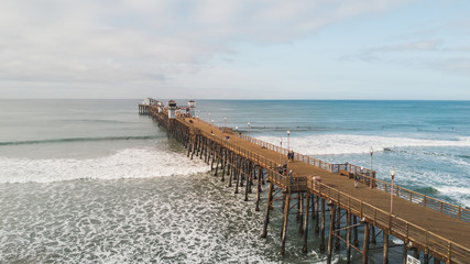 OCEANSIDE, California (USA): Drone shot of the longest wooden maiden pier of the USA West Coast, Oceanside Pier. 