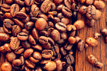 Morning with delicious coffee. Coffee seeds from above as a background.