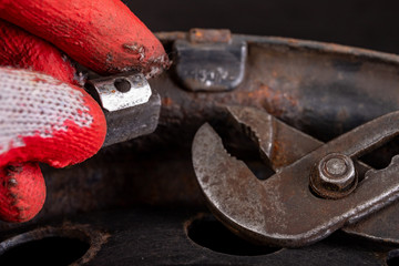Lead weights on rim and tongs. Accessories for the vulcanizer in the workshop.