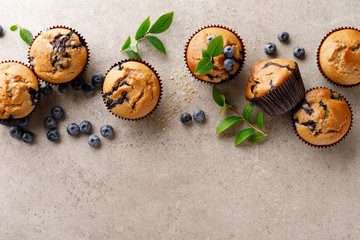 Blueberry muffins with fresh berries, top view