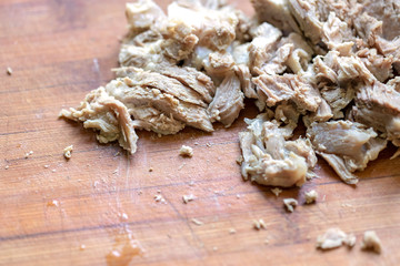 stack boiled meat pieces on the wooden board at domestic kitchen. traditional food.