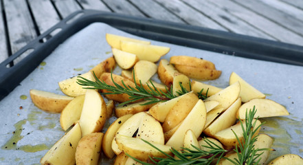 Food - grilled potatoes with Rosemary, black pepper, salt and olive oil. Delicious to barbeque.