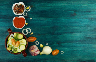 VEGETABLES ON BACKGROUND. FRESH VEGETABLES AND SPICES ON A WOODEN SURFACE. COPY SPACE