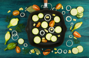 VEGETABLES ON BACKGROUND. FRESH VEGETABLES AND SPICES NEAR A FISHING SET ON A WOODEN SURFACE. COPY SPACE