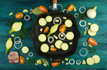 VEGETABLES ON BACKGROUND. FRESH VEGETABLES AND SPICES NEAR A FISHING SET ON A WOODEN SURFACE. COPY SPACE