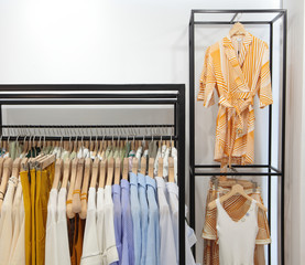 Rack with stylish clothes.Trendy color.In clothing store.Concept monochrome contrast color.Design