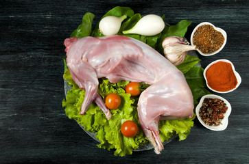 Fresh green zucchini on a dark table. The view from the top. Copy space.