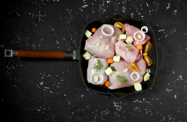 Fresh green zucchini on a dark table. The view from the top. Copy space.