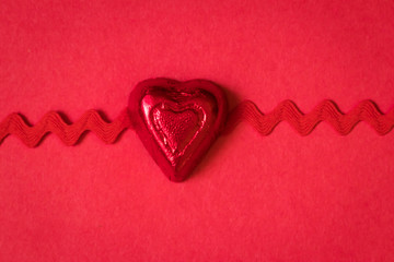 Red Candy Heart on a Red Background