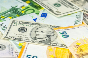 Close up on various Euro USD Dollars banknotes on the table business and finance money wealth savings credit finance