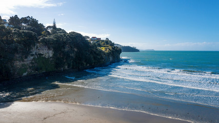 Aerial View from the Beach, Green Trees and Cliff of Orewa in New Zealand - Auckland Area