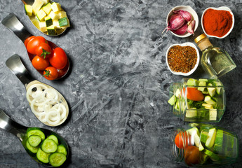 Vegetables on the background. Fresh vegetables (cucumbers, tomatoes, onions, garlic, dill, green beans) on a gray background. Top view. Copy space