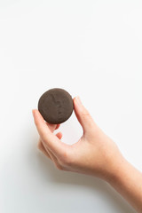 Girl holding thin mints cookies, chocolate mint thin round cookies