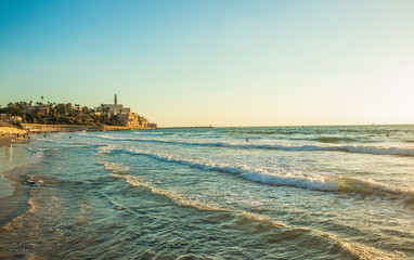 Tel Aviv Mediterranean sea sand beach waterfront scenic landscape photography with ancient city Jaffa background famous world heritage touristic site, copy space