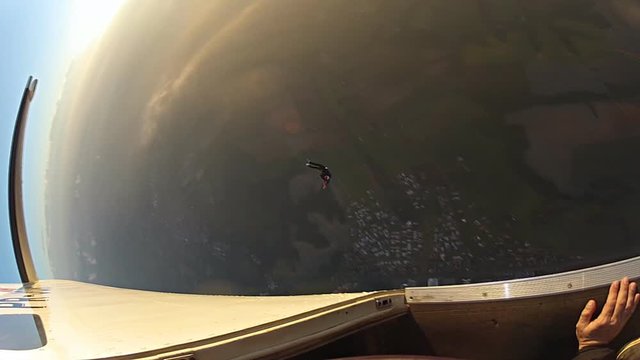 Skydiver jumps off the plane in slow motion