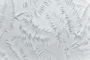 Pure white flat lay pattern with handmade paper cut tropical plant palm leaves feathers on white background.