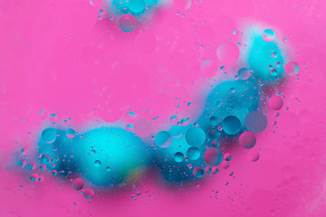 Abstract macro molecular pattern of colored oil bubbles on water. 