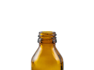 Close-up of a small amber empty pharmaceutical glass bottle without cap for aromatherapy or mock-up on white background