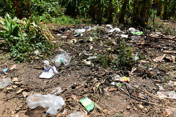 Garbage in the park spilled garbage on ground of the big city used dirty plastic bottles dirty environmental pollution ecological problem - Recycling and waste help the environment
