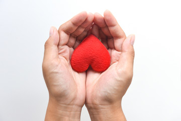 heart on hand for philanthropy concept - woman holding red heart in hands for valentines day or donate help give love warmth take care - obrazy, fototapety, plakaty
