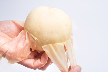 Yangshan honey peach being peeled