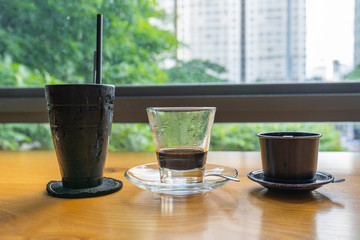 Vietnamese traditional fin coffee in cityscape and garden background