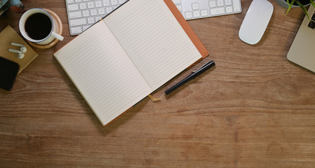 Blank open notebook in comfortable workplace with office