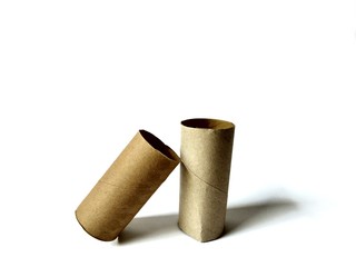 Empty toilet paper rolls on white background