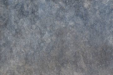 Grunge concrete wall with crack and stains in industrial building. Cement texture for design and background.