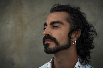 portrait of a young man with long hair and beard