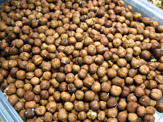 heap of many peeled hazelnuts