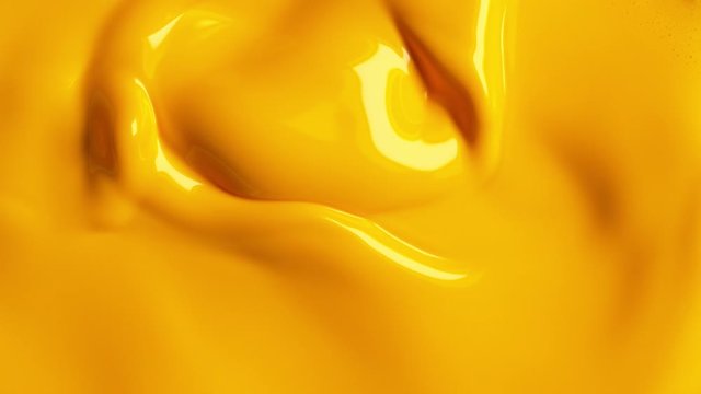 Super slow motion of mixing yellow paint. Abstract background. Filmed on high speed cinema camera, 1000 fps.