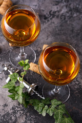 Two glasses with white wine on a textural background. Copy space. Place for your text.