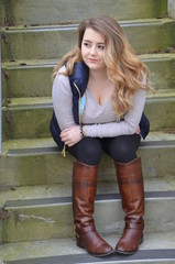 Girl with boots on stairs