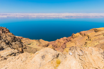Fototapeta na wymiar View from the Zara trail, near the Panorama Dead Sea Complex in Jordan. Zara Cliff Walk offers stunning views of the Dead Sea coast.