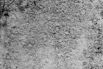 Texture of a concrete wall with cracks and scratches which can be used as a background