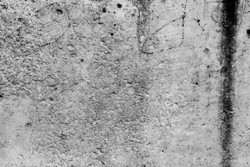 Texture of a concrete wall with cracks and scratches which can be used as a background