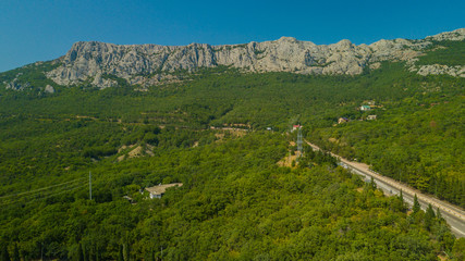 Fototapeta na wymiar Crimea trip: view from drone of curvy mountain road