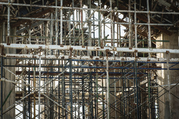 Scaffolding and steel in construction site.