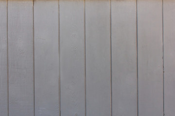 A neutral grey painted treated wood background
