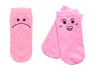 Socks with eye and smile face. Blank shot cute pink single cotton sock isolated on white background with clipping path. A pair of warm baby pink sock on white color. Lifestyle and fashion concept.