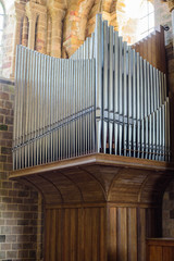 Organ in the Church of St. Michael. The medieval abbey of Mont Saint-Michel. Details of the temples...
