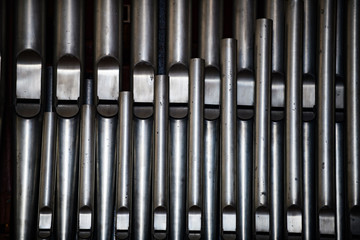 Organ in the Church of St. Michael. The medieval abbey of Mont Saint-Michel. Details of the temples inside the city on the island. Normandy. France
