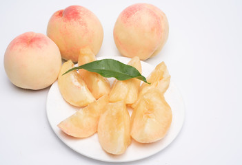 A plate of fresh cut peach pulp