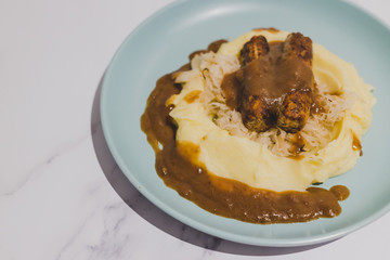 vegan sausages with sauerkraut potato mash and vegan gravy