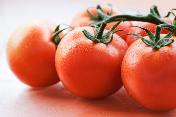 close-up tomatoes. background of close up image of a fresh tomato with water droplets